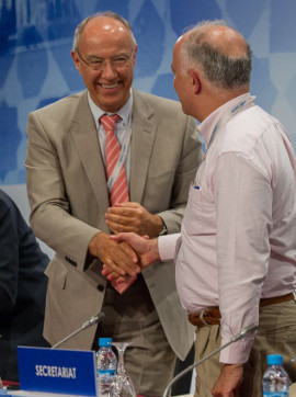 WIPO Director General Francis Gurry (left) congratulates Turkey's UN ambassador on adoption of a treaty increasing access for the blind. (WIPO/Emmanuel Berrod) 